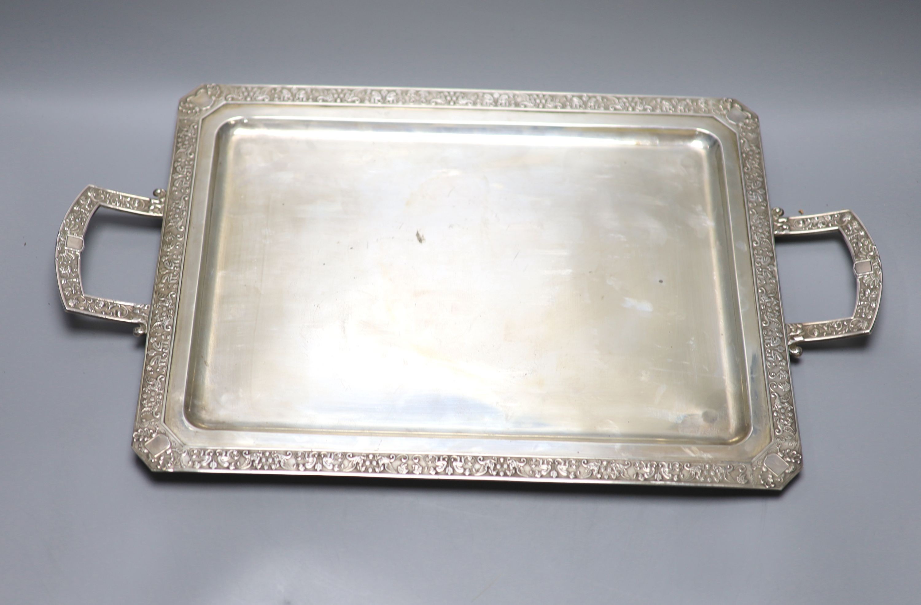 A continental white metal two handled tea tray, stamped Hernandez, 53.9cm over handles, 41.5oz.